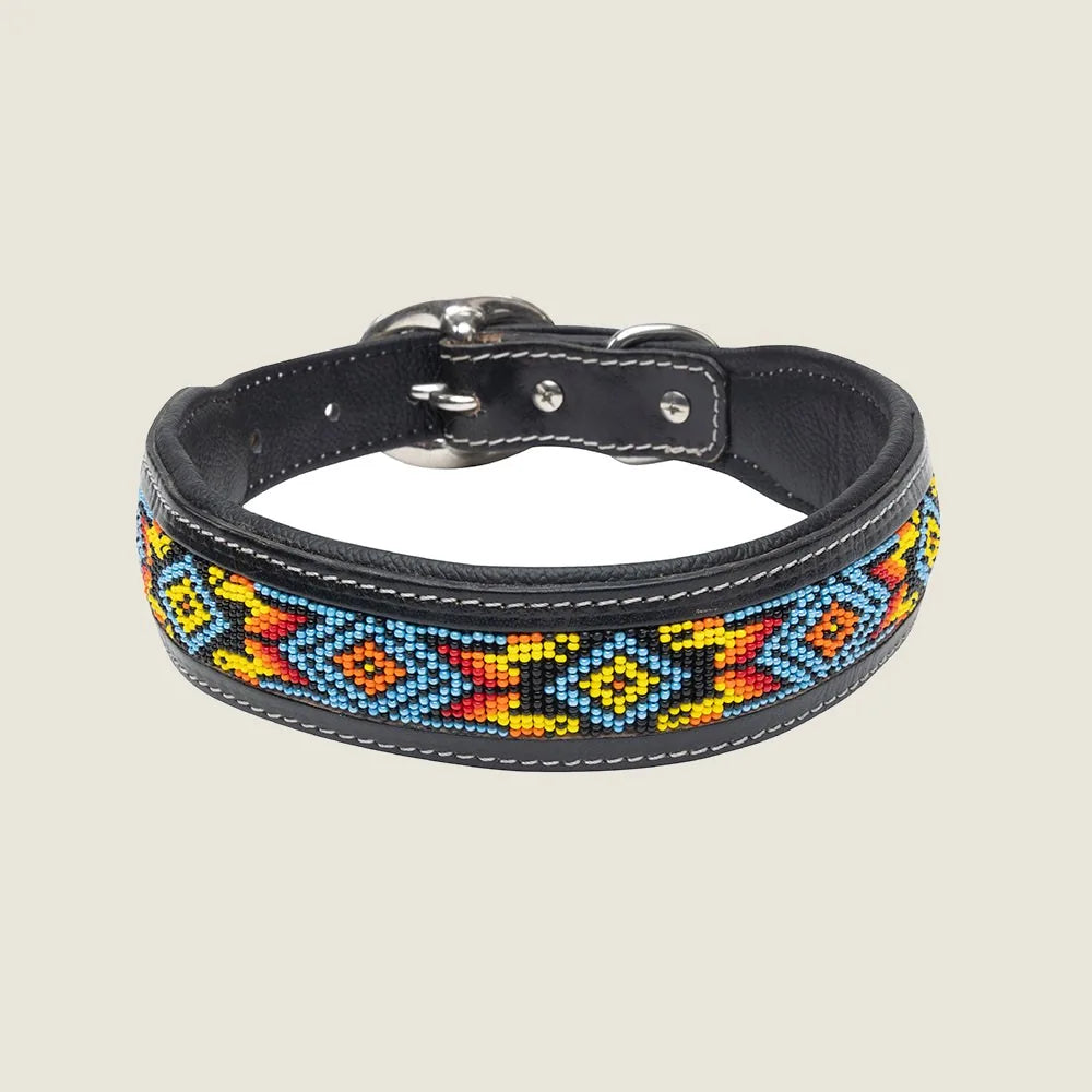 Hand-beaded dog collar in black leather featuring vibrant tribal patterns of blue, red, yellow, and orange accents.