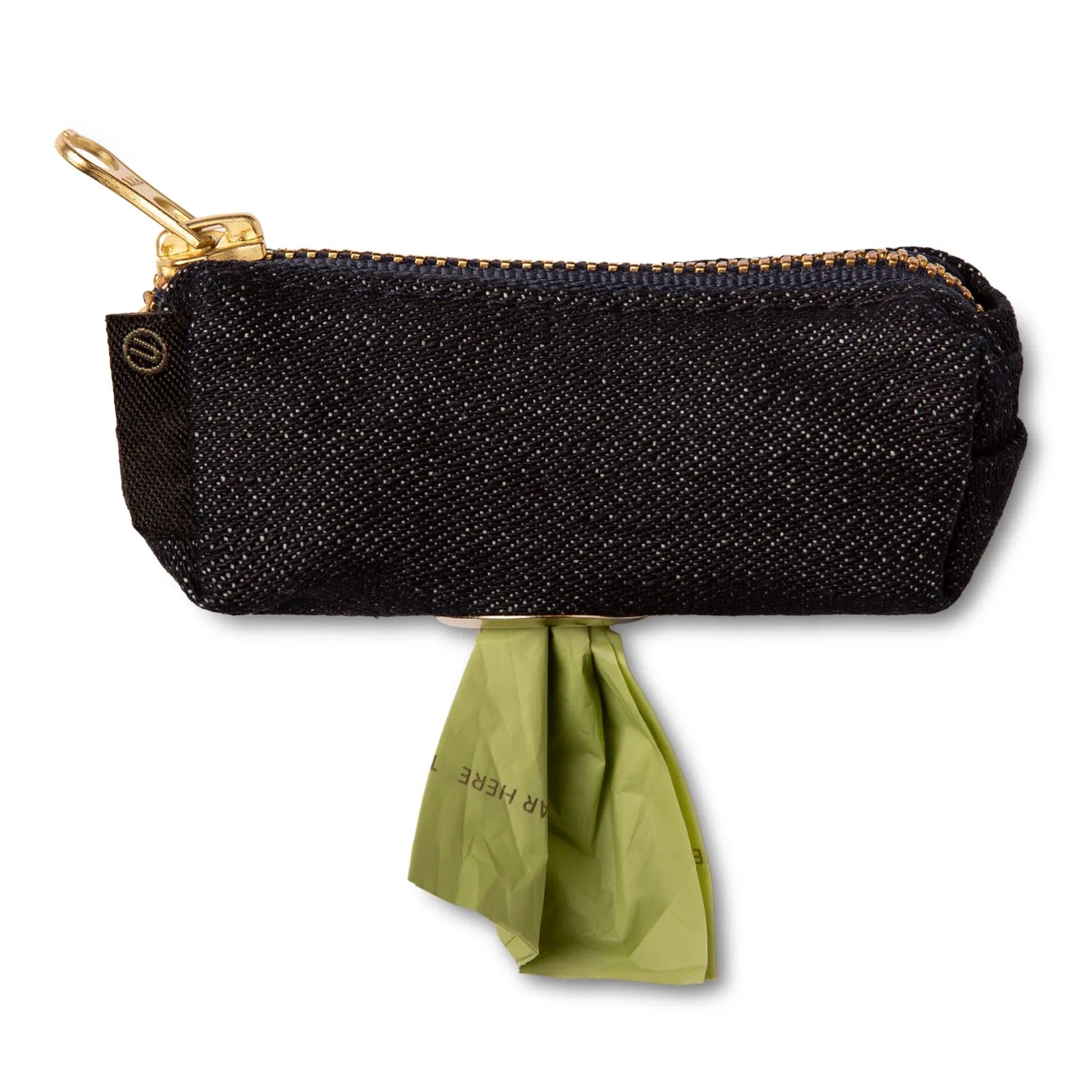 Compact black denim dog bag holder with a brass zipper, holding a green dog waste bag. Ideal for walks.