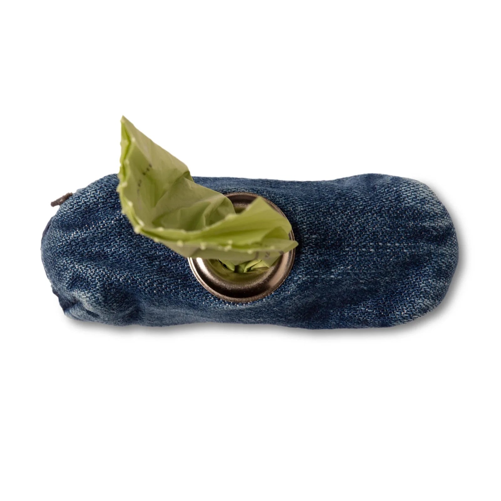 Compact raw denim dog bag holder with a roll of poop bags peeking out from the brass zipper opening.