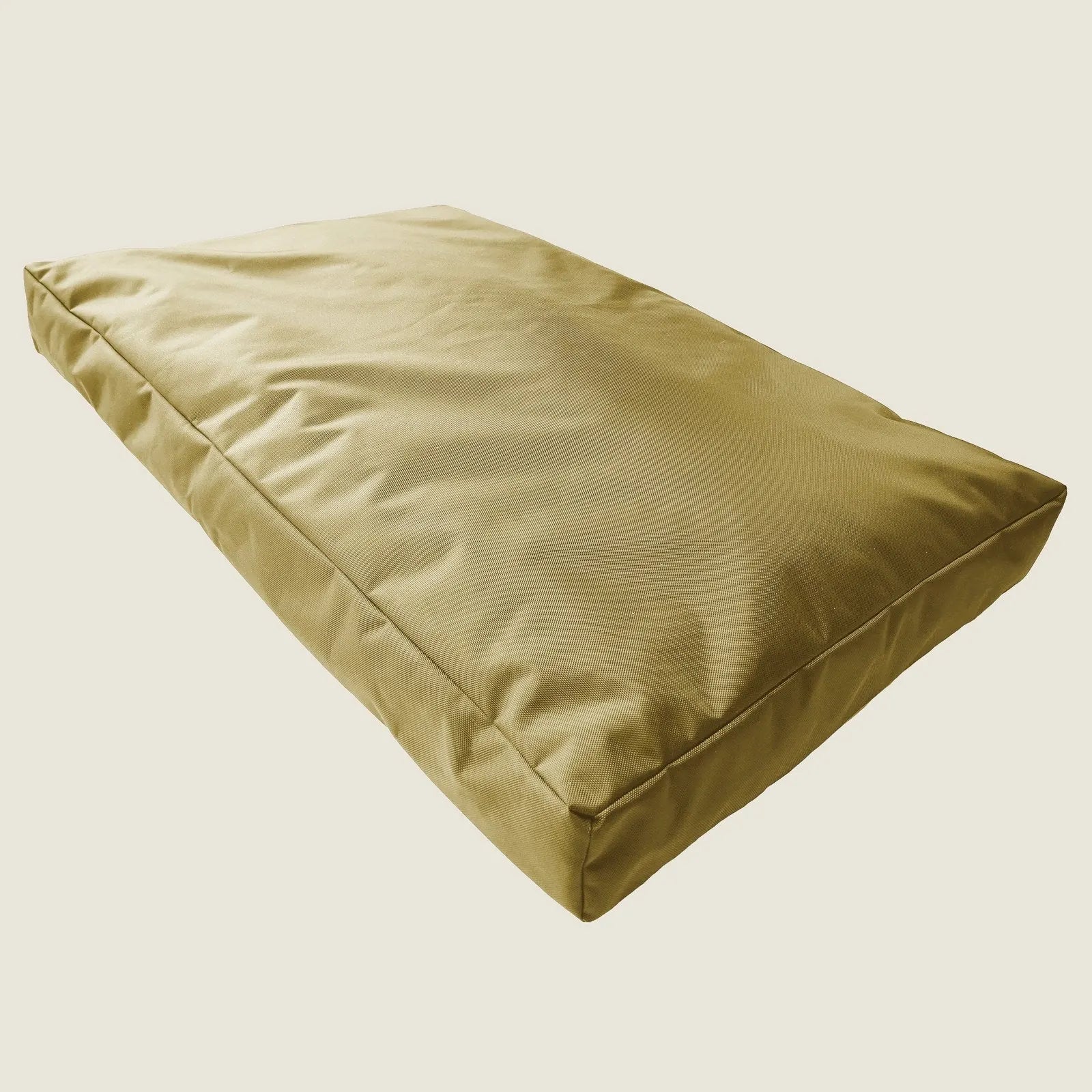 Durable camel-colored orthopedic dog bed with a smooth nylon cover and supportive foam interior, ideal for comfort and rest.