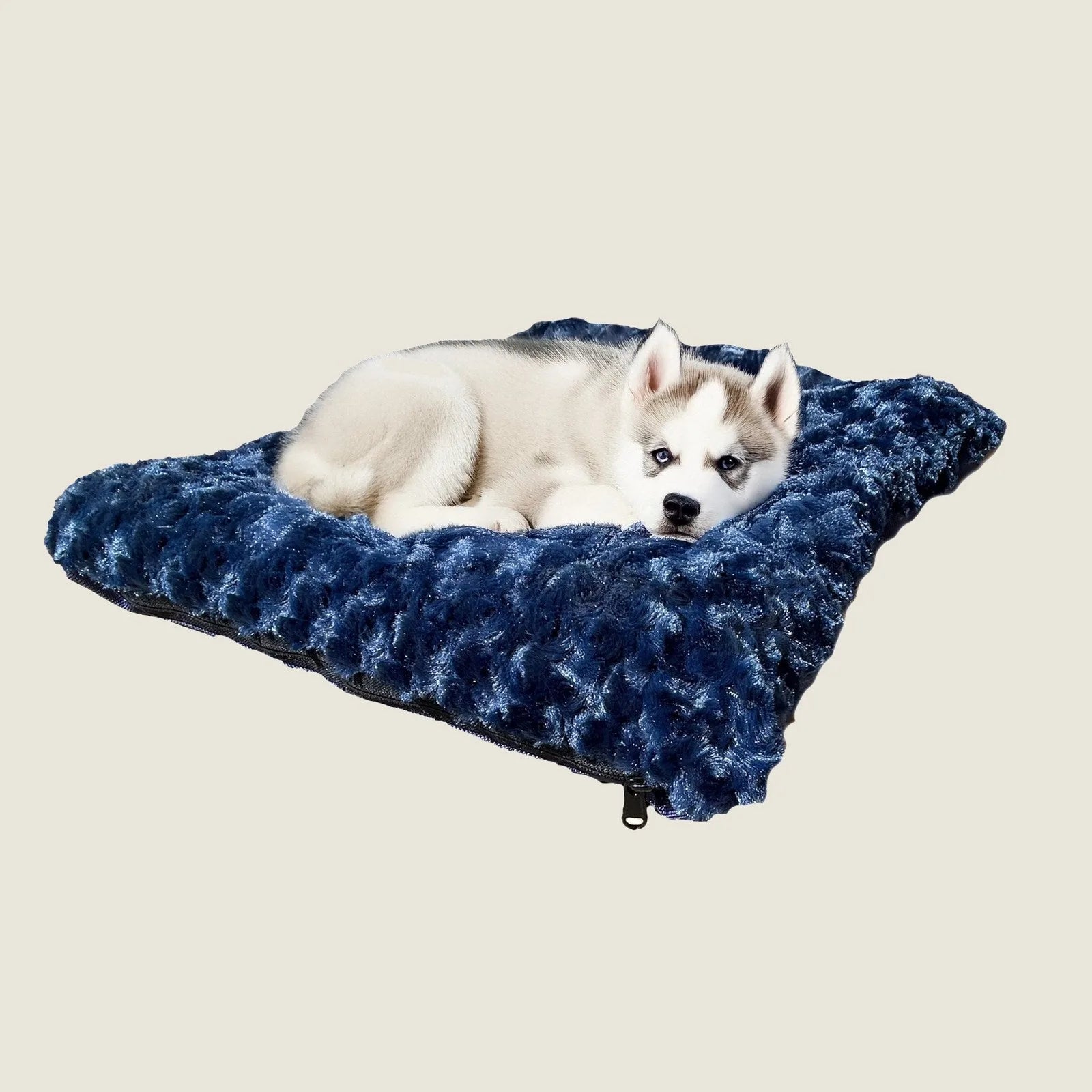 Cozy rectangular bolstered dog bed in deep blue with soft Minky Rose Fleece, featuring a resting puppy.
