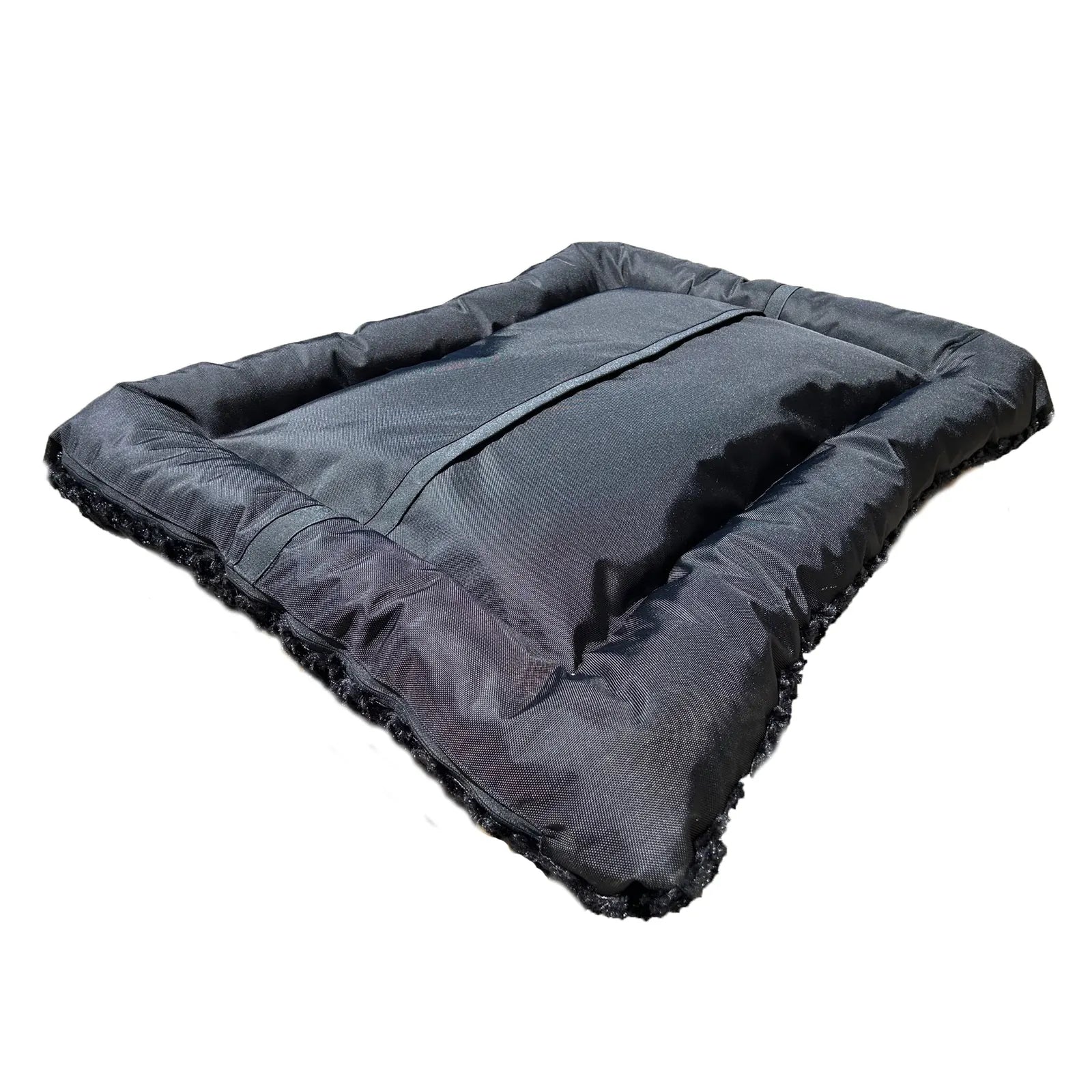 Rectangular bolstered dog bed in black with a soft, textured fleece outer and durable nylon bottom, showcasing its cozy de...
