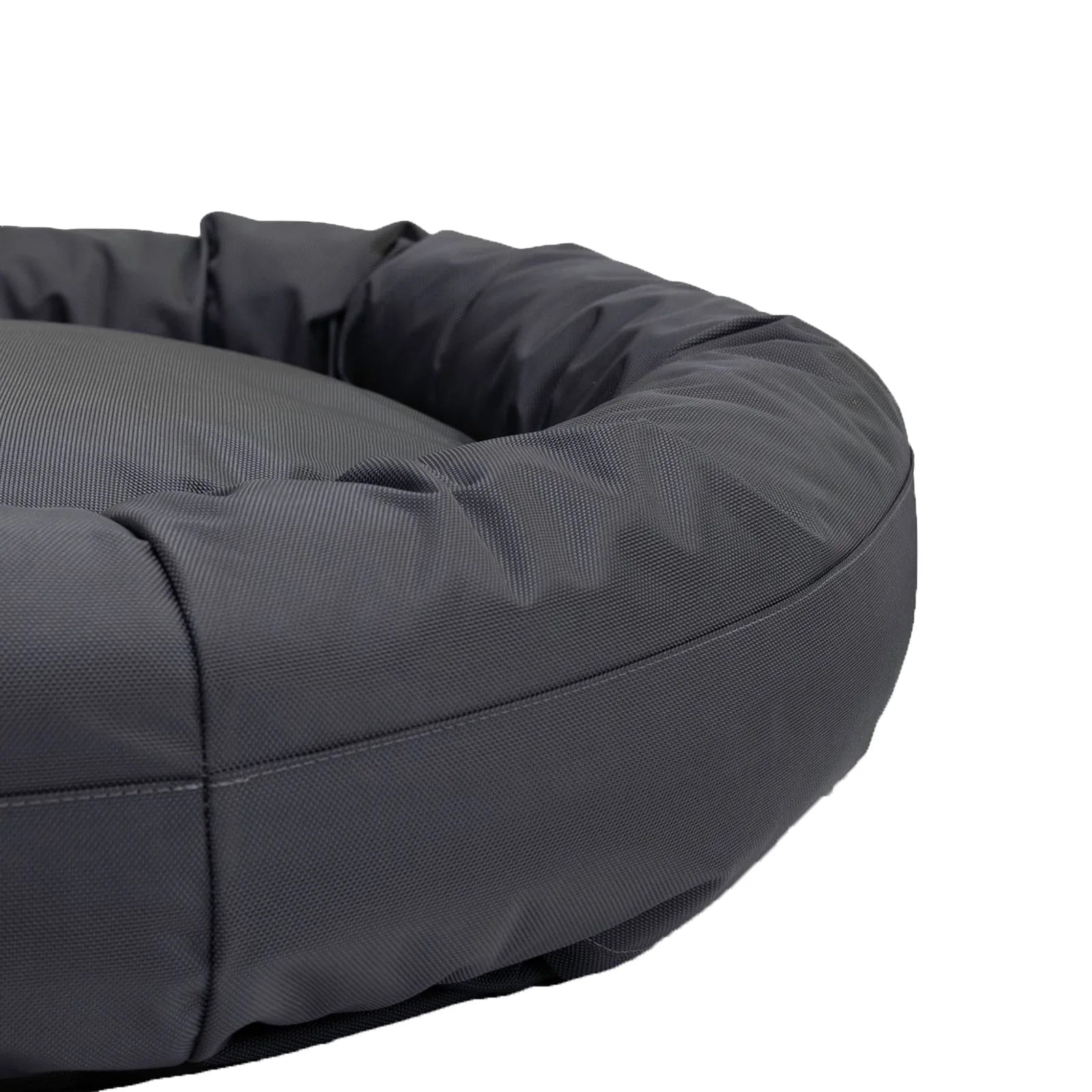 Round bolstered dog bed in charcoal, featuring a durable nylon cover and plush inner for comfort and support.