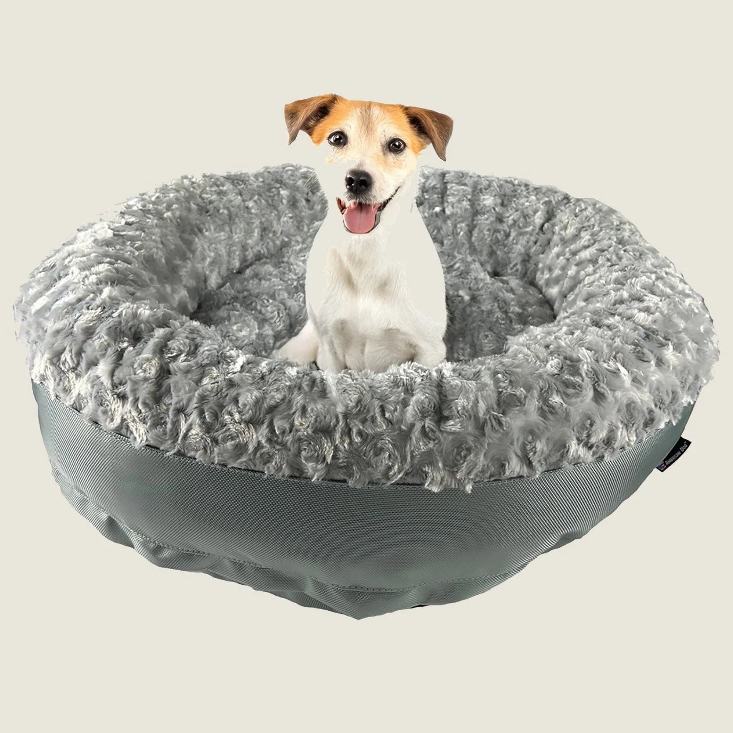 Round bolstered dog bed in gray with soft, fluffy fabric, featuring a joyful dog sitting comfortably inside.