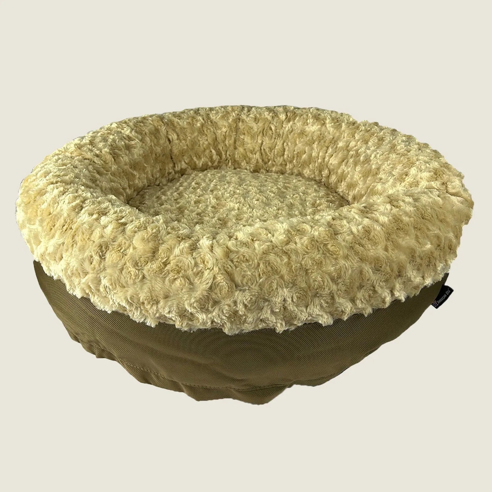 Round bolstered dog bed in camel with a soft, textured fleece cover and durable nylon bottom, perfect for comfort and supp...