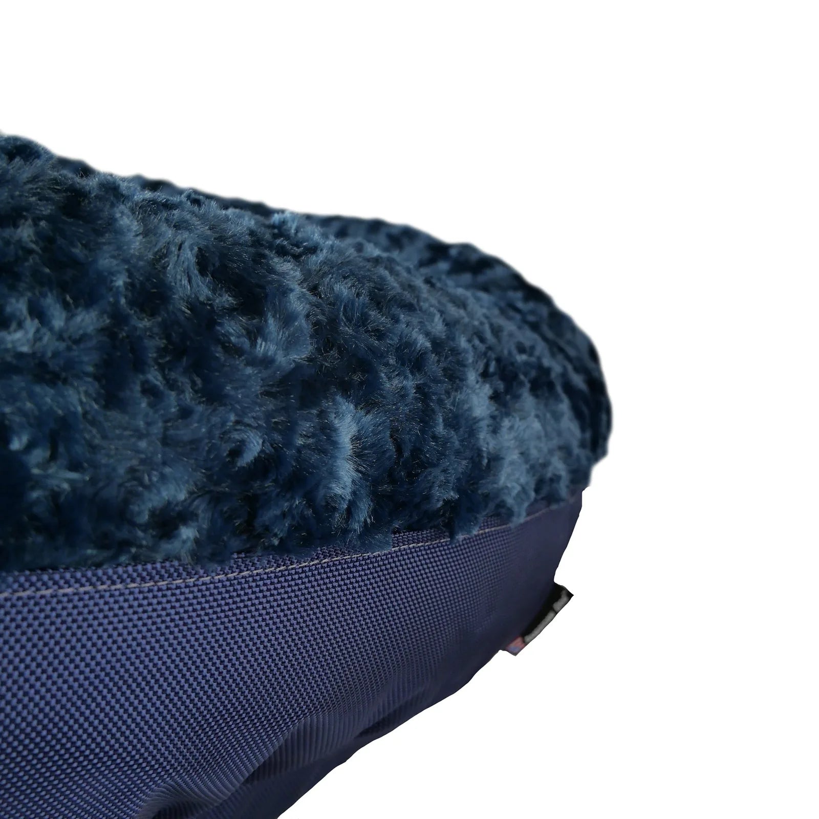 Soft navy bolstered dog bed featuring a plush Minky Rose Fleece surface and durable nylon ballistic bottom.