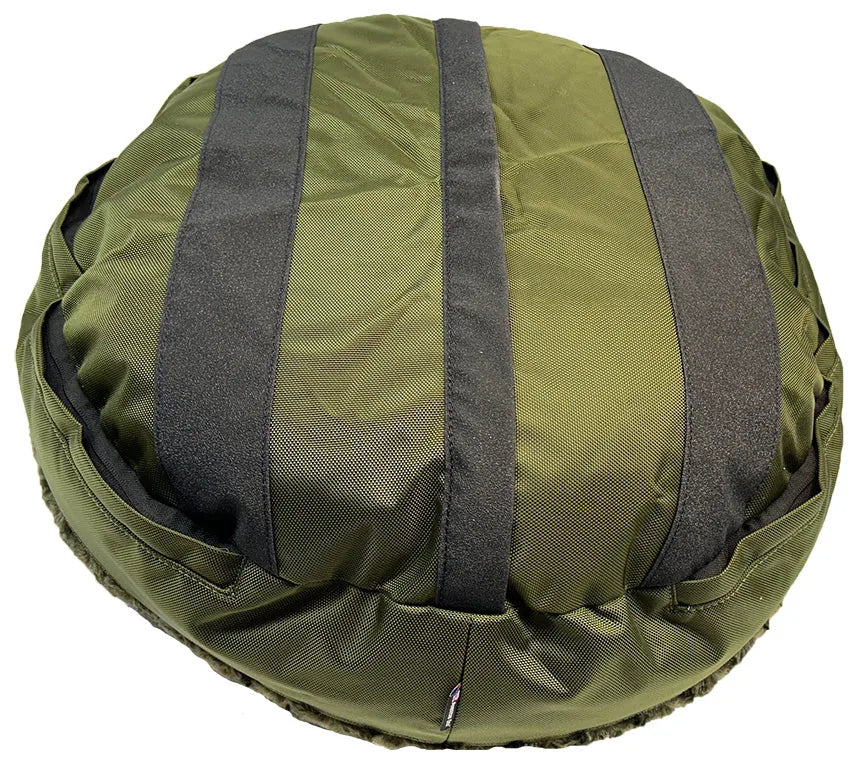 Round bolstered dog bed in olive green with a textured nylon surface and black accents, designed for durability and comfort.
