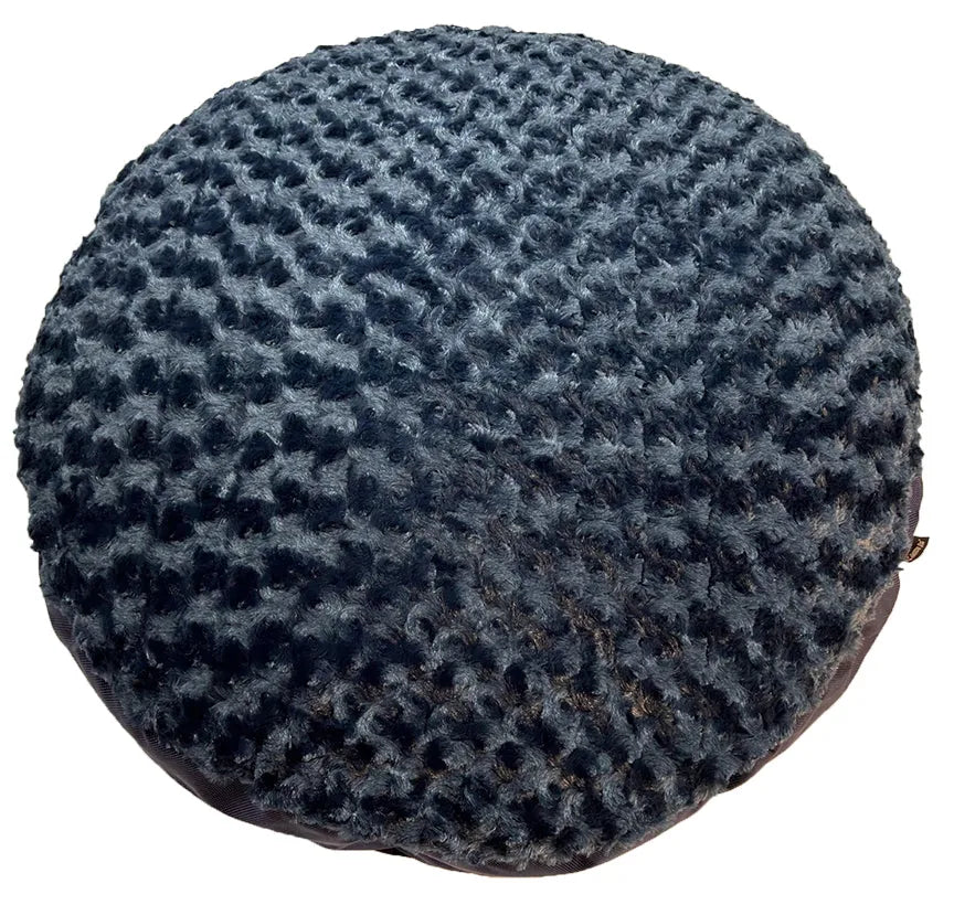Round black dog bed with a plush, textured top and smooth sides, ideal for curling up comfortably.