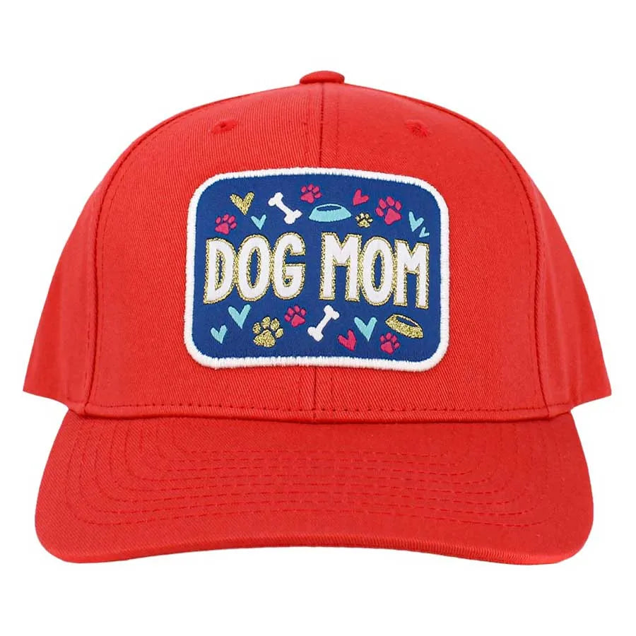 Red baseball cap featuring "DOG MOM" on a navy patch with playful dog-themed graphics, perfect for dog lovers.