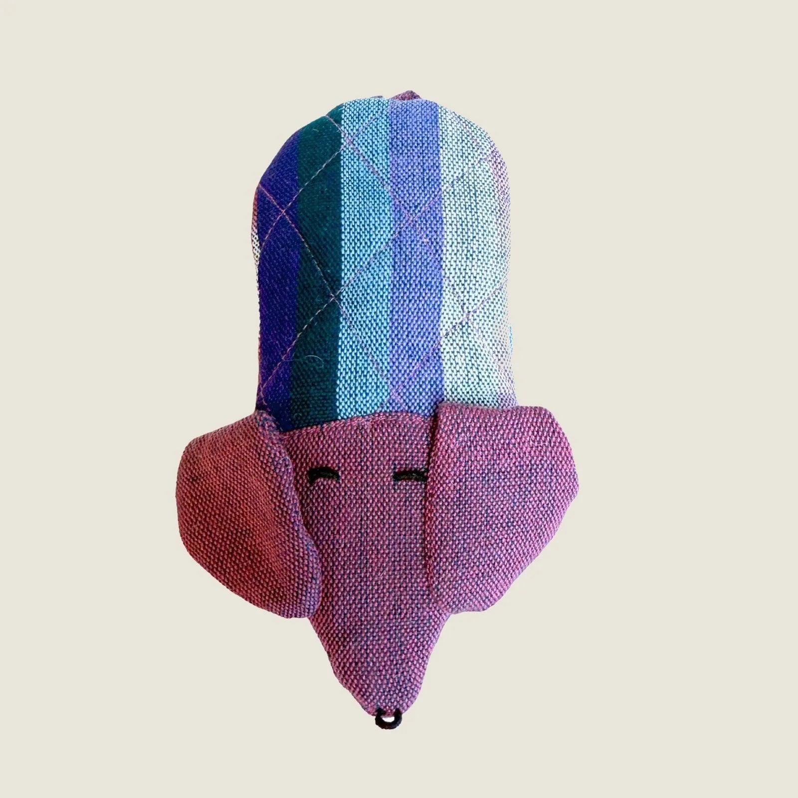 Colorful dog-shaped skillet handle holder made from cotton, featuring a playful design in purple and blue hues.
