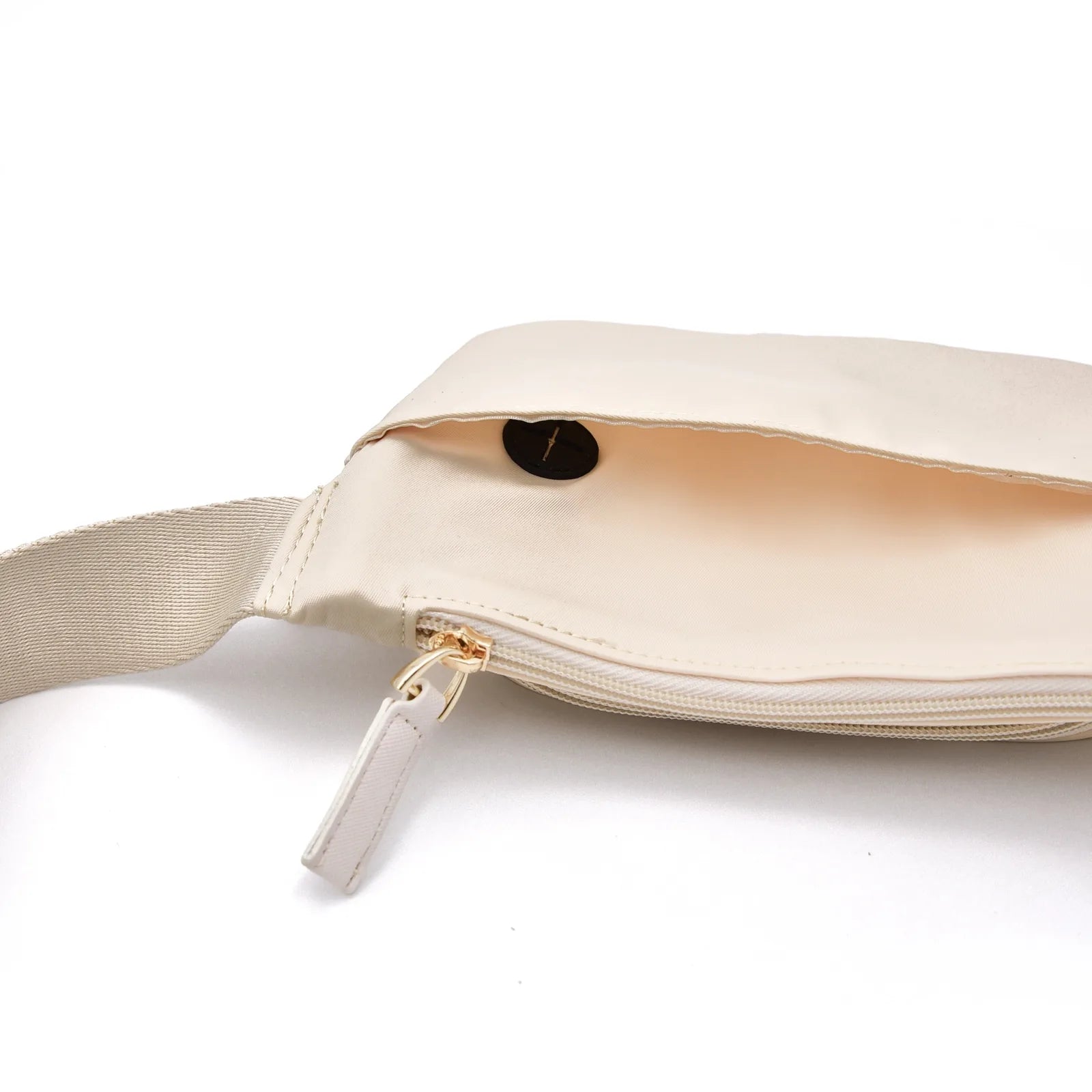 Lightweight beige dog walking bag with gold zipper, revealing a spacious interior and adjustable strap for convenience.