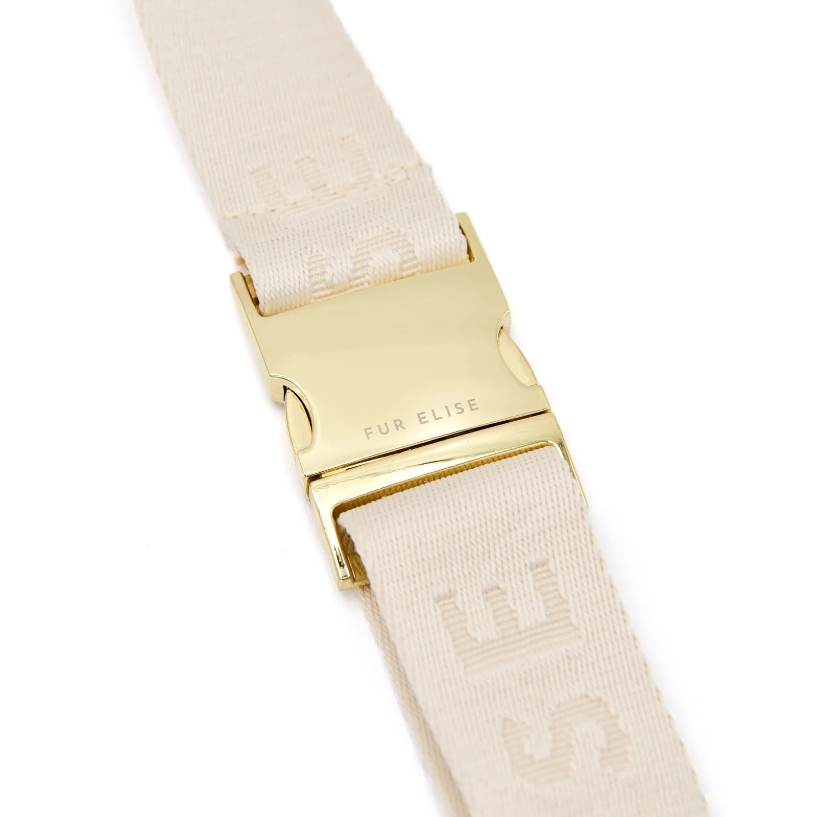 Close-up of the gold buckle and beige strap with "Fur Elise" lettering from the Elise Galleria dog walking bag.