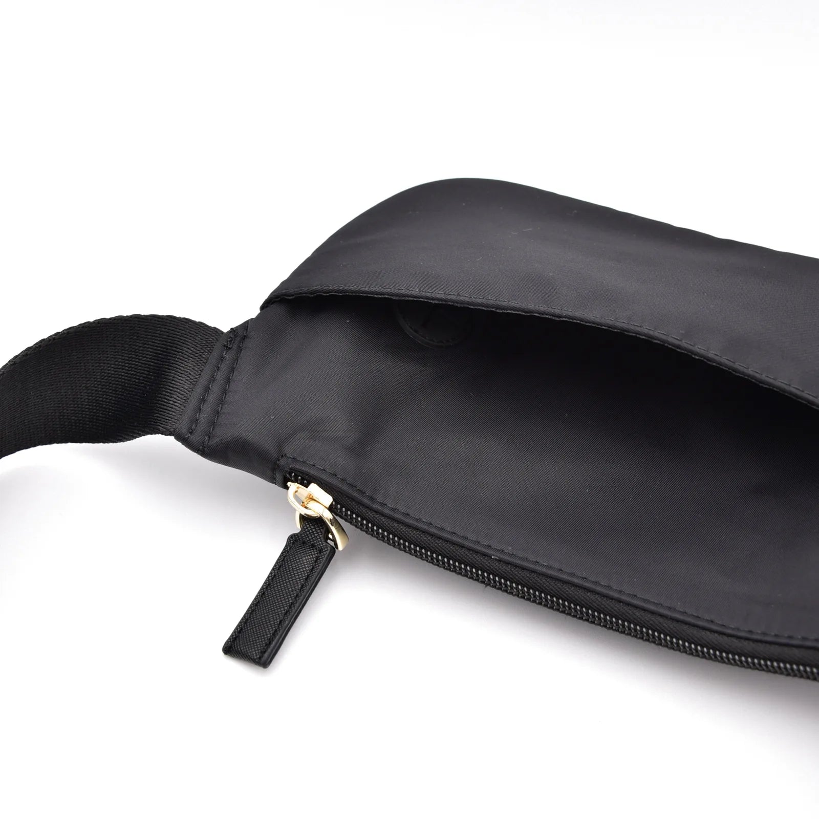 Belt bag in black nylon featuring a gold zipper and adjustable strap, ideal for dog walking essentials.