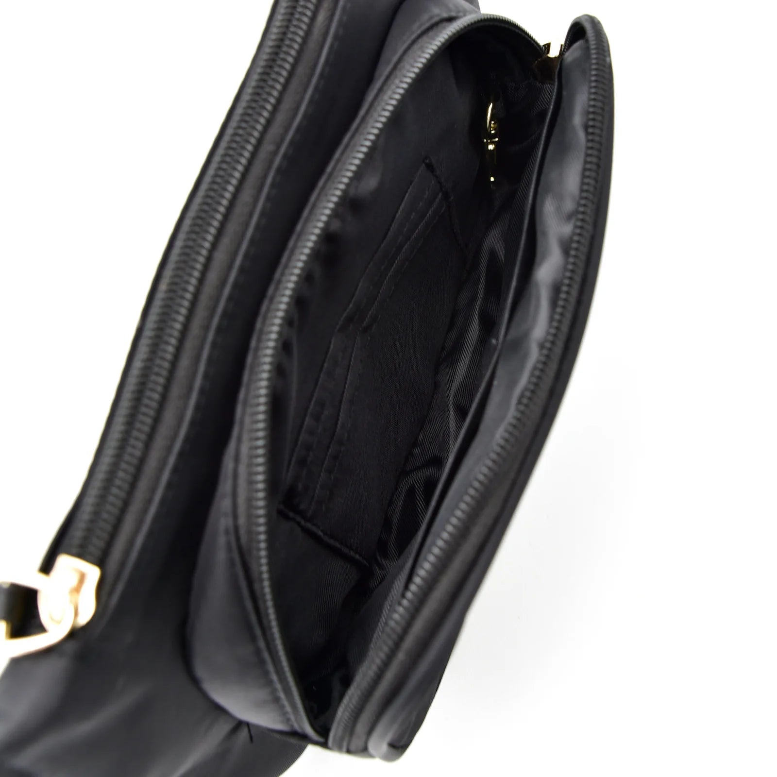 Interior view of the black Dog Walking Bag - Noir, showcasing multiple pockets and a gold zipper closure.