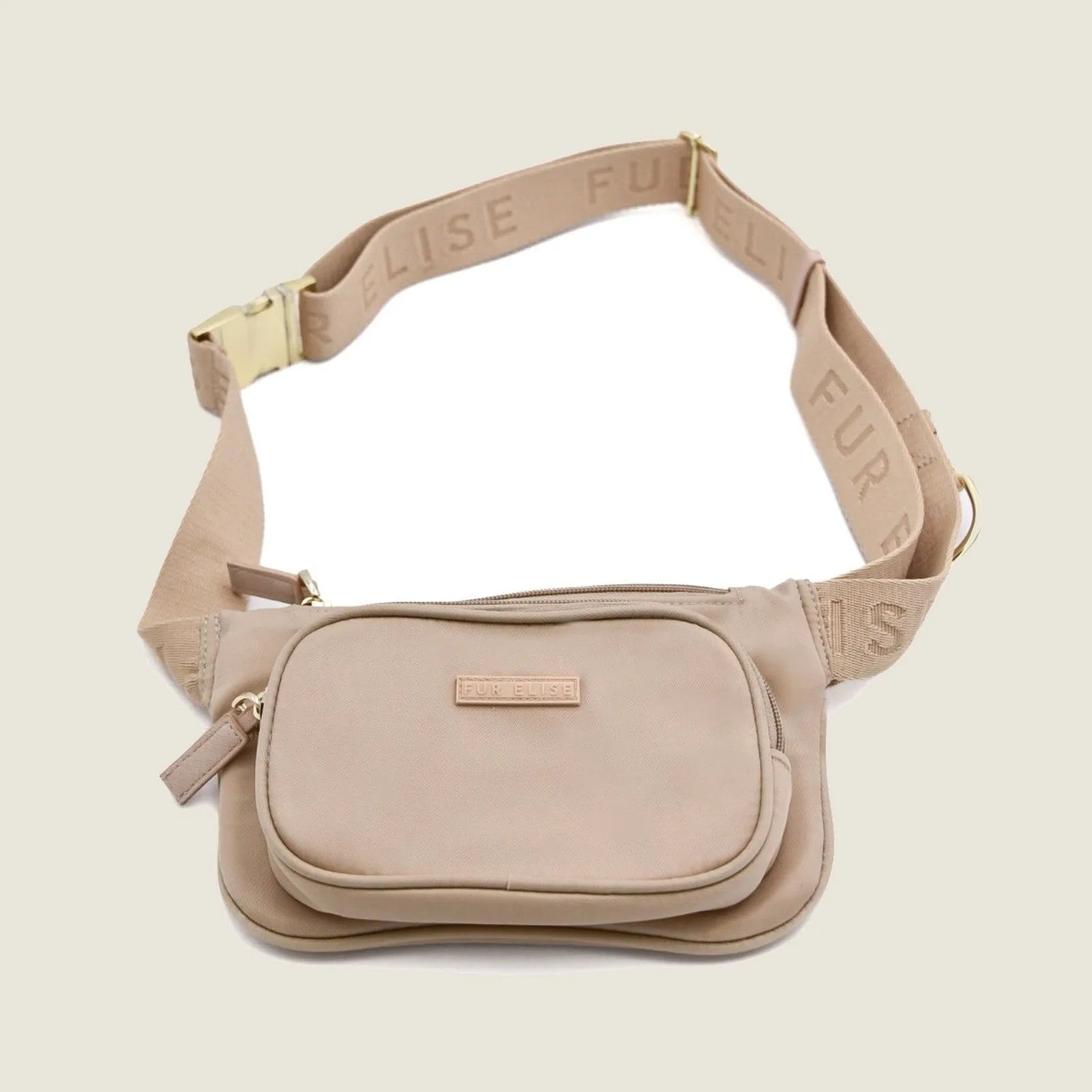 Lightweight sand-colored dog walking bag with adjustable strap and multiple pockets for organizing essentials.