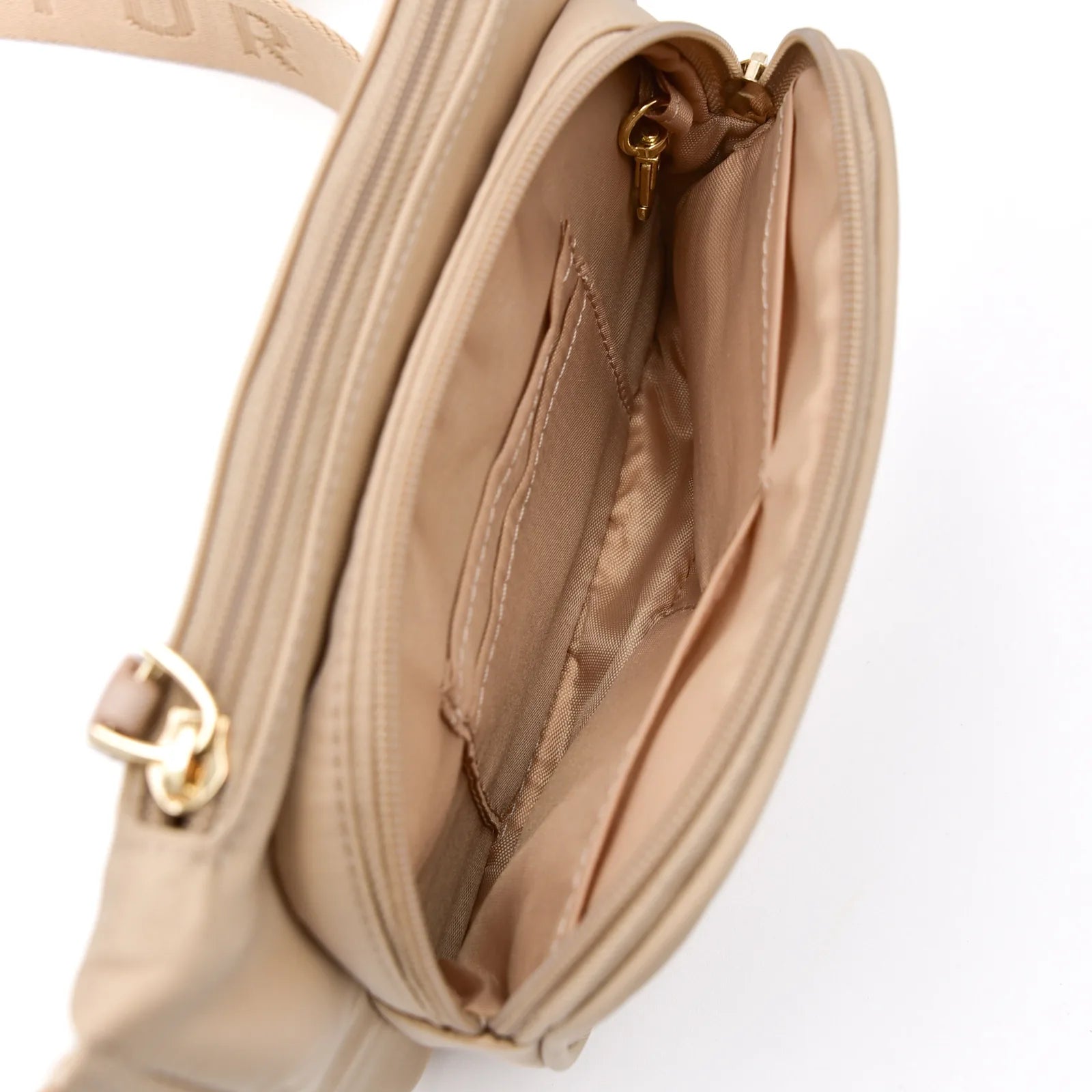 Interior view of the lightweight sand-colored Dog Walking Bag by Elise Galleria, showcasing multiple compartments and a go...