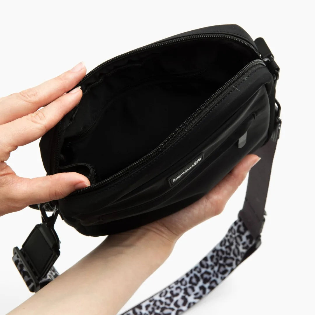 Interior view of the black EverWoof Doggy Owner Essentials Bag with a patterned strap, showcasing its spacious pocket.