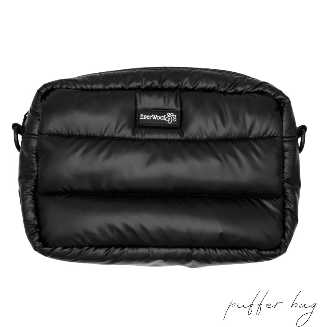 Black puffer bag by EverWoof, featuring a sleek, padded design with interior and exterior zippered pockets.