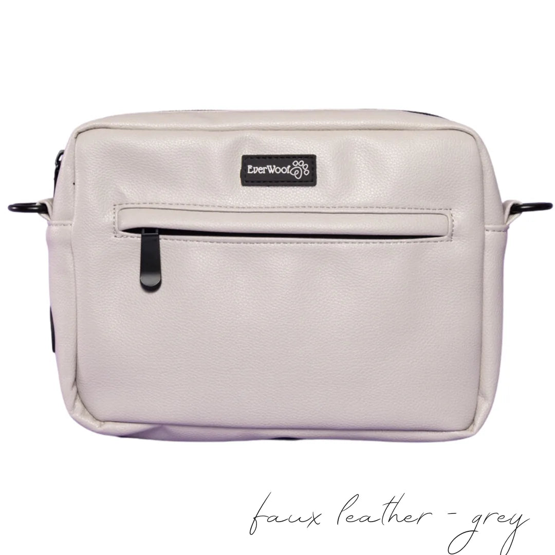 Grey faux leather dog owner essentials bag with exterior zipper pocket and EverWoof logo, perfect for walks.