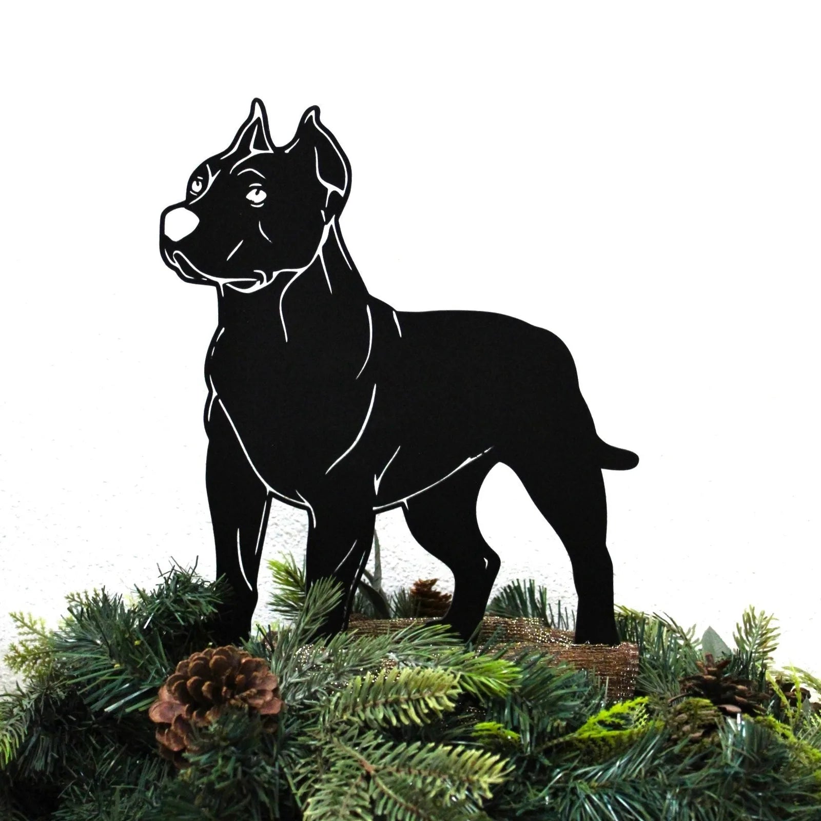 Black metal Dogo Argentino silhouette standing on greenery, showcasing a sleek design and sturdy construction.