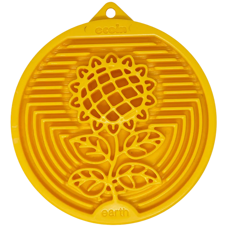 Yellow nylon lick mat featuring an earth-inspired sunflower design, textured for slow licking and mental stimulation.