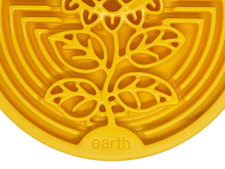 Earth eCoin nylon lick mat for dogs in bright yellow, featuring a sunflower design and textured surface for enrichment.