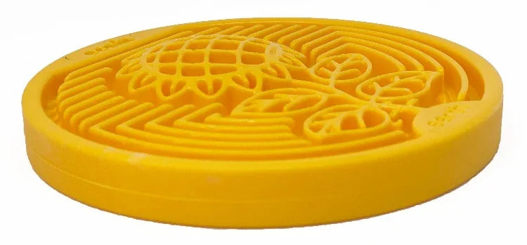 Yellow nylon lick mat with textured sunflower design, perfect for dog enrichment and slow feeding.