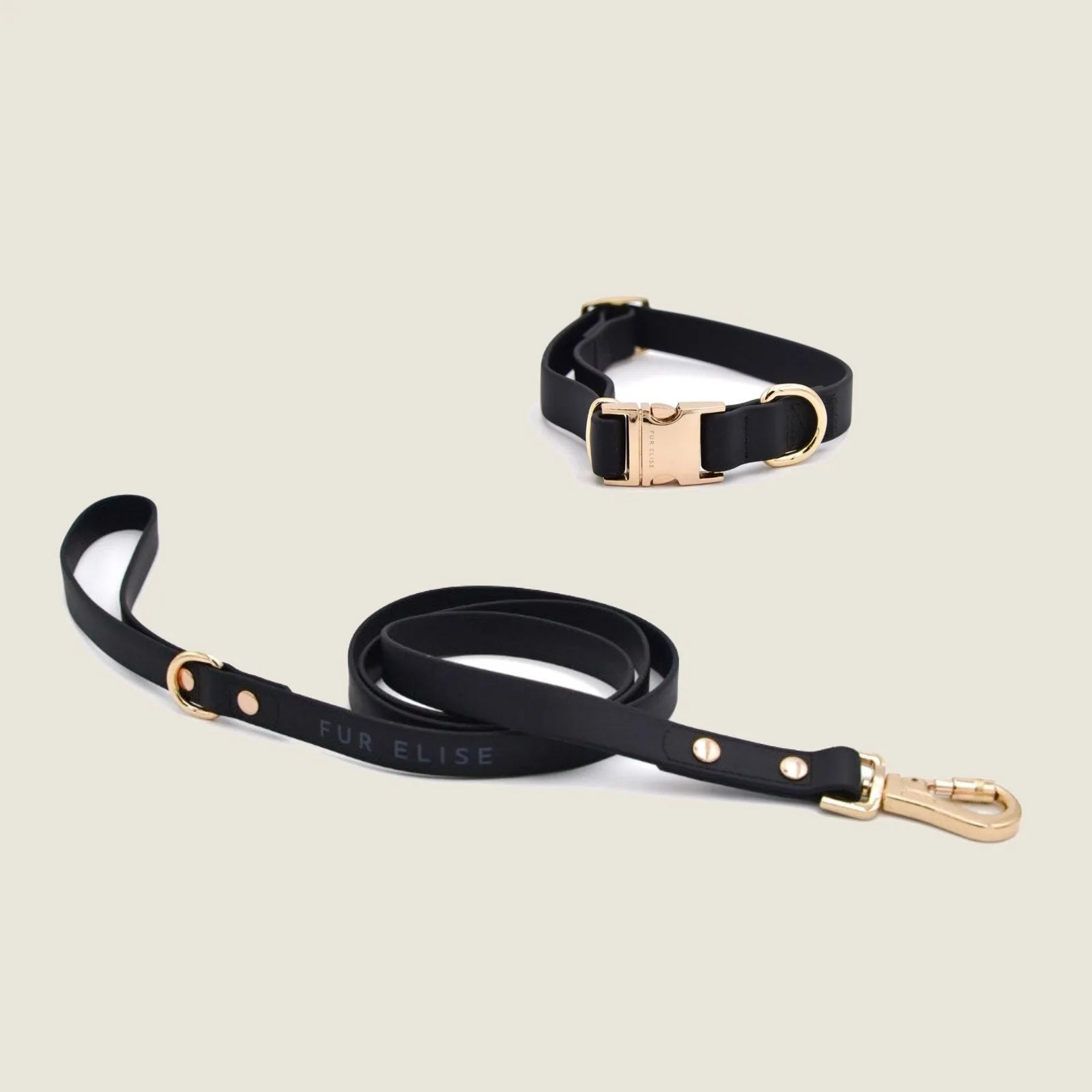 Elise Collar & Leash Set in Noir with light gold hardware, soft rubbery feel, stylish and weather-resistant.