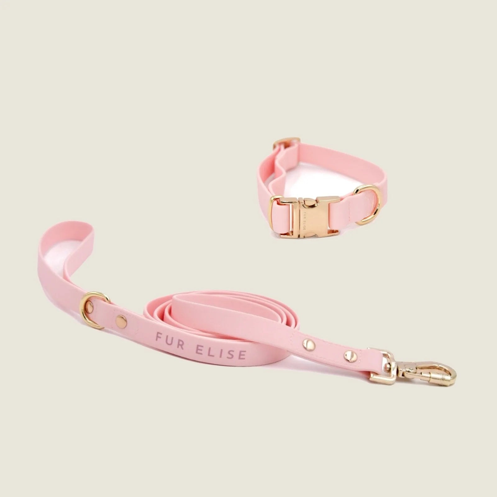 Elise Collar & Leash Set in rose, featuring soft rubbery materials and light gold hardware for stylish dog walks.