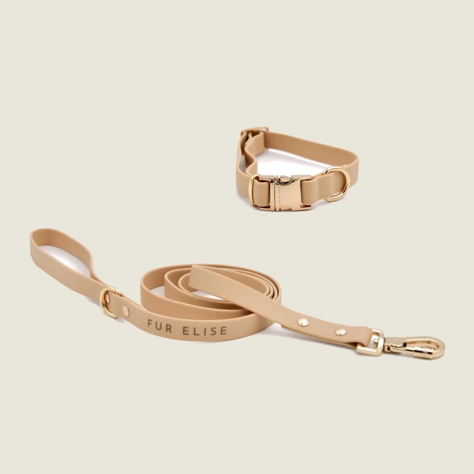 Elise Collar & Leash Set in soft sand color, featuring gold hardware and printed "FUR ELISE" on the leash.