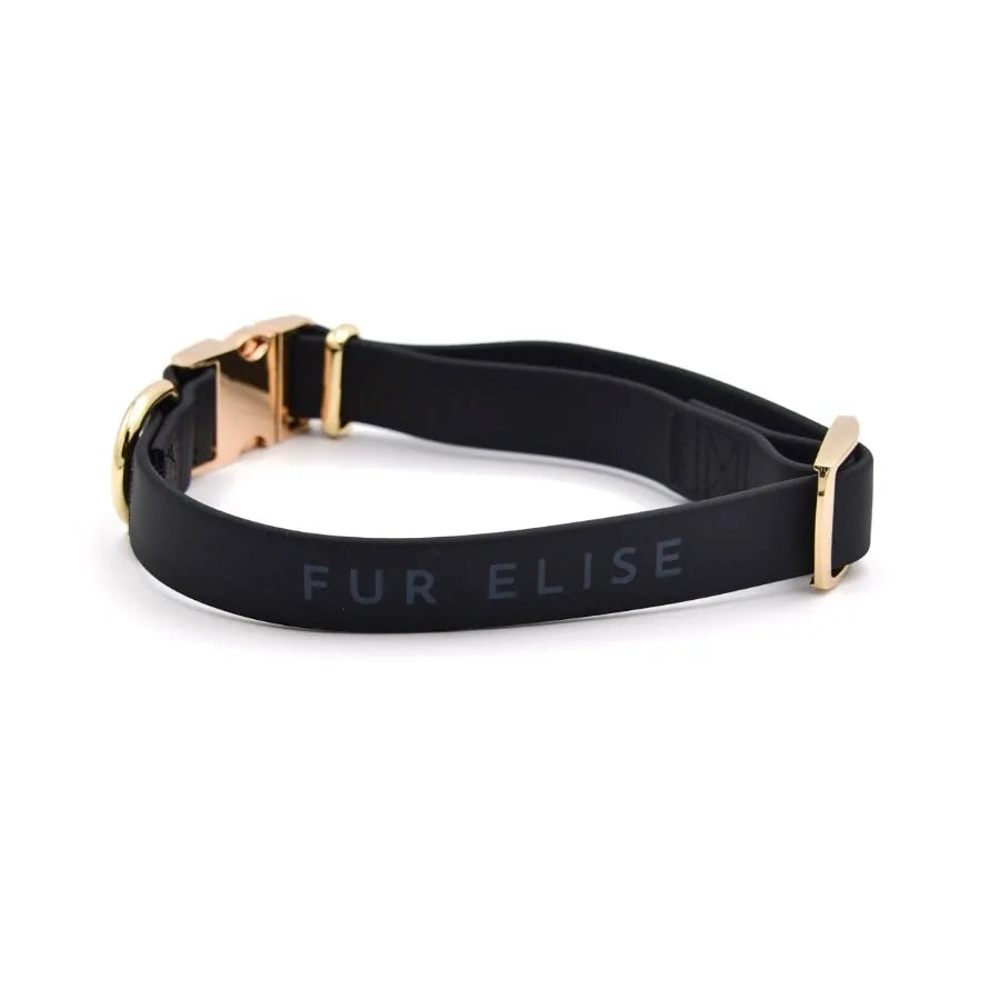 Elise Collar in Noir, featuring a soft matte rubber texture and elegant gold hardware for stylish dog walks.