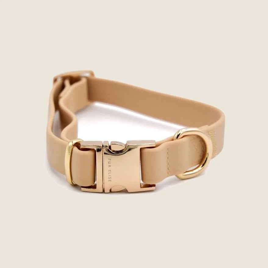 Sand-colored Elise Collar with gold hardware and soft rubbery texture, designed for comfort and durability during walks.