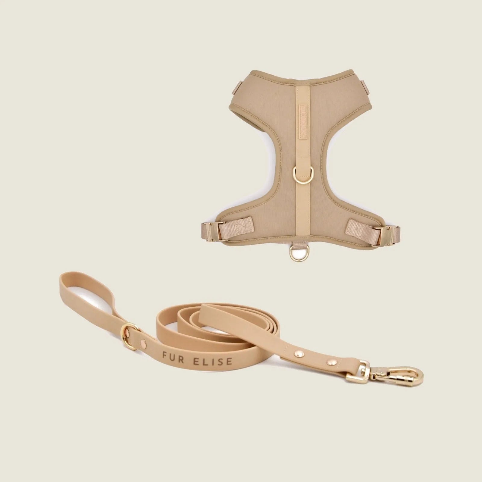 Soft sand-colored Elise harness with breathable mesh lining and matching leash featuring a gold carabiner clip.