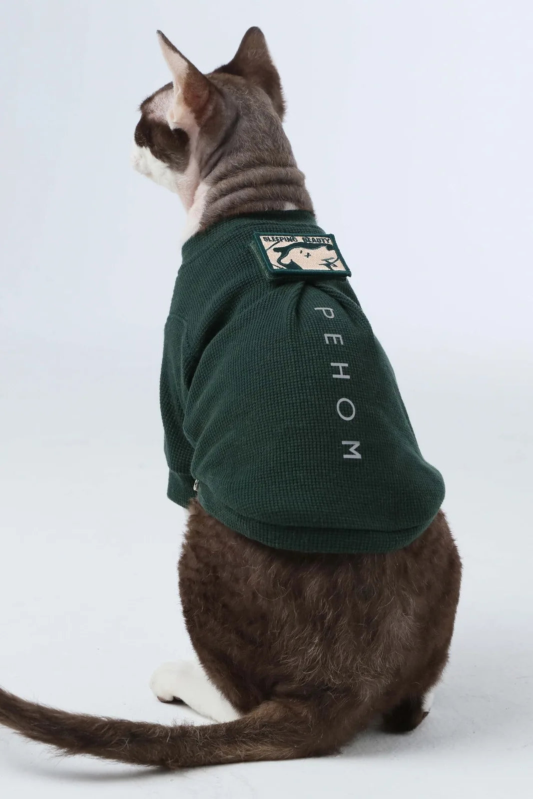 Green waffle plaid dog t-shirt with embroidered patch and reflective print, designed for comfort and visibility.