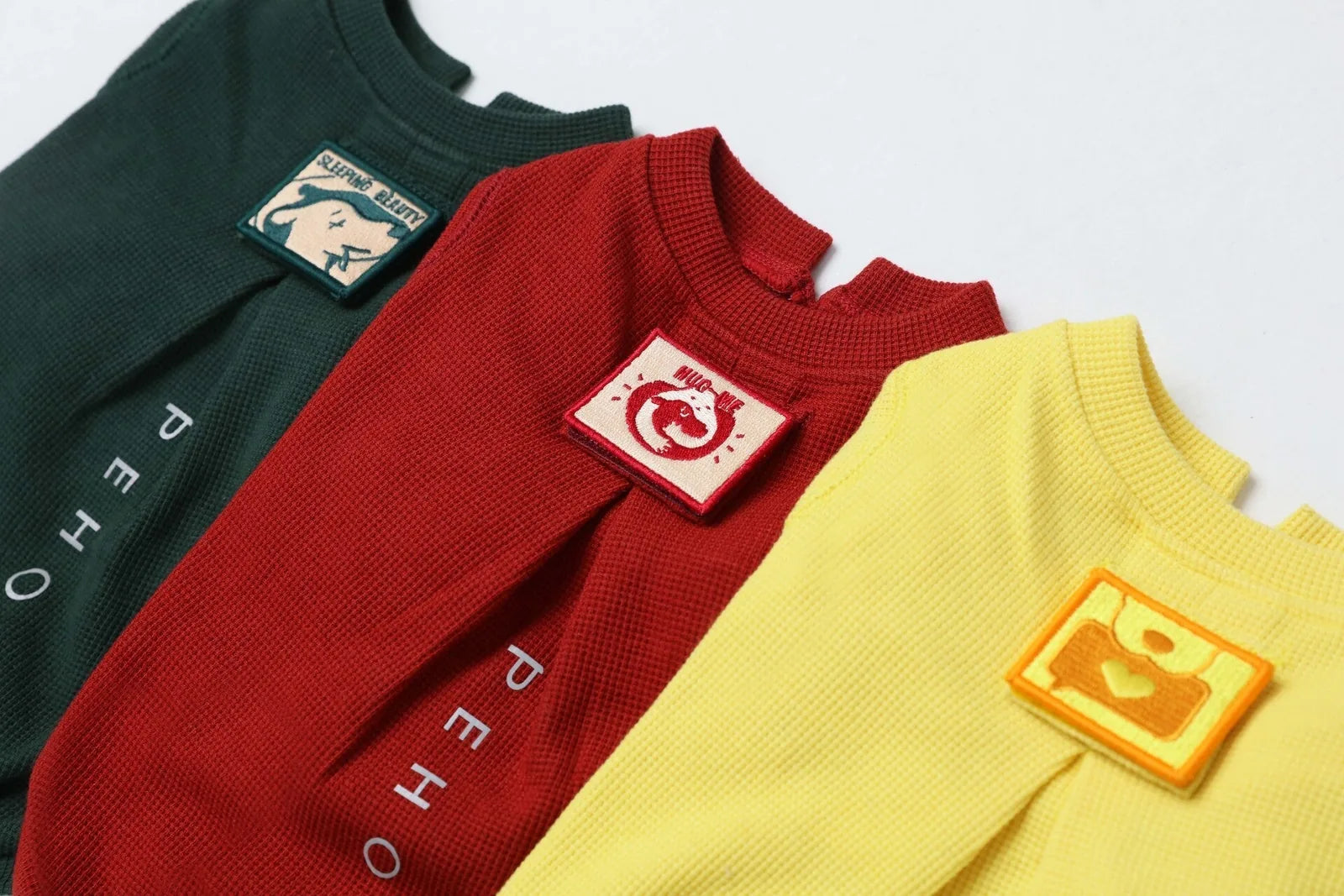 Embroidery waffle t-shirts in green, red, and yellow, featuring unique embroidered patches and waffle plaid fabric.