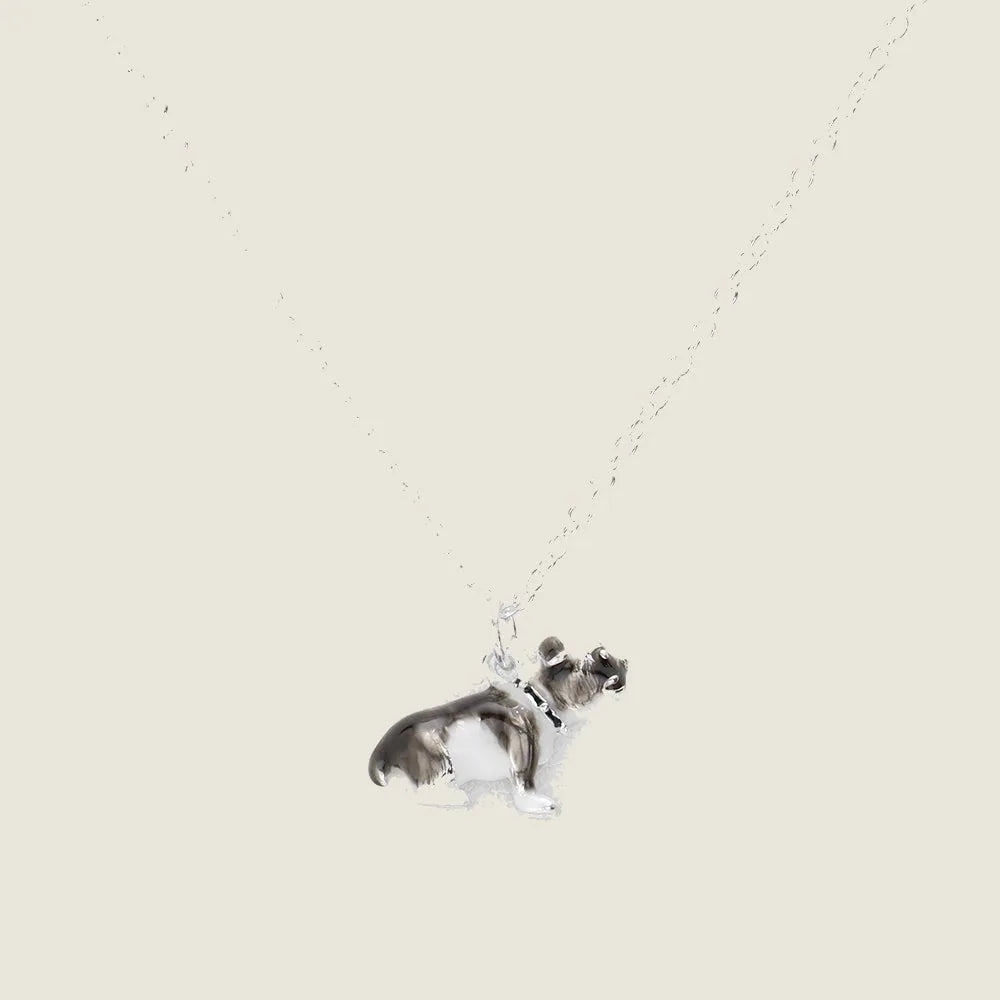 Silver enamel dog pendant necklace with a sleek design, on a delicate chain, perfect for dog lovers.