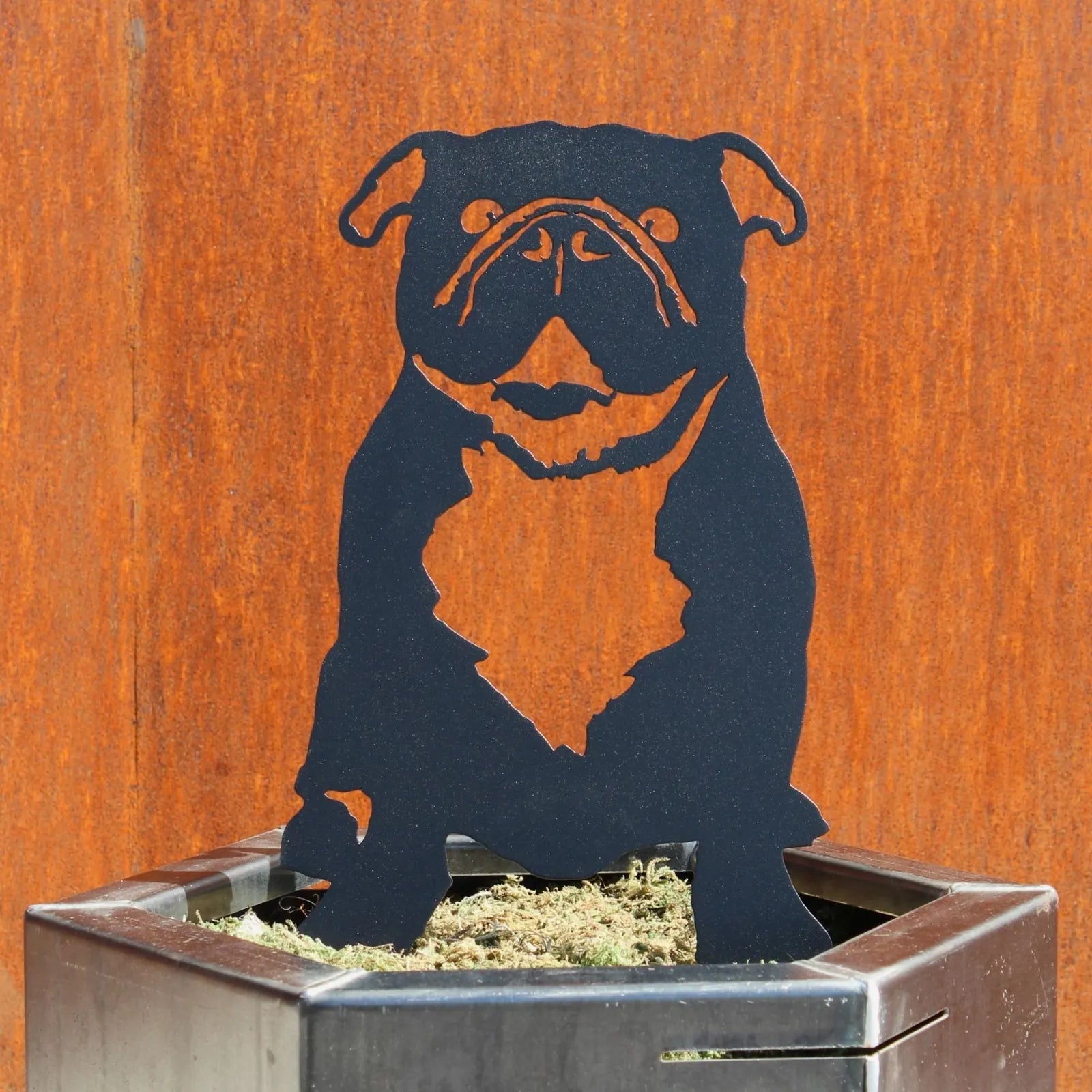 Black English Bulldog metal silhouette displayed in a planter, crafted from durable Corten steel.