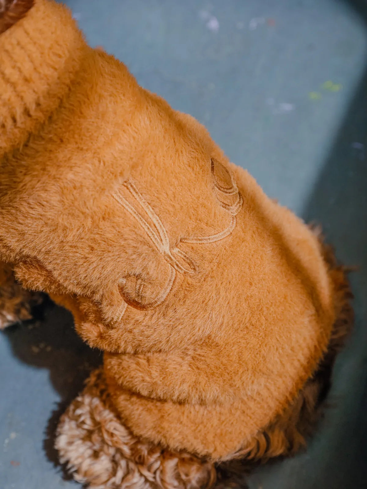 Cozy green Eskimo fuzzy sweater for dogs, made with soft, breathable fabric and stretchable openings for easy wear.
