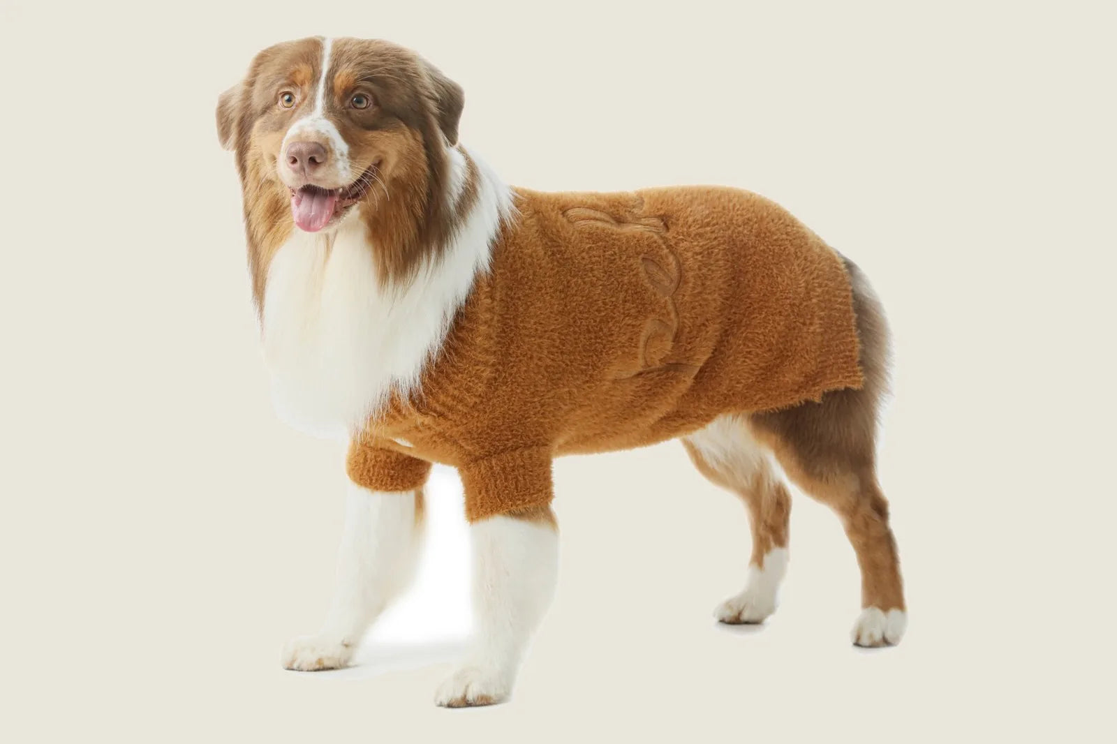 Cozy orange Eskimo fuzzy sweater for dogs, featuring a snug design and soft, breathable acrylic fabric.
