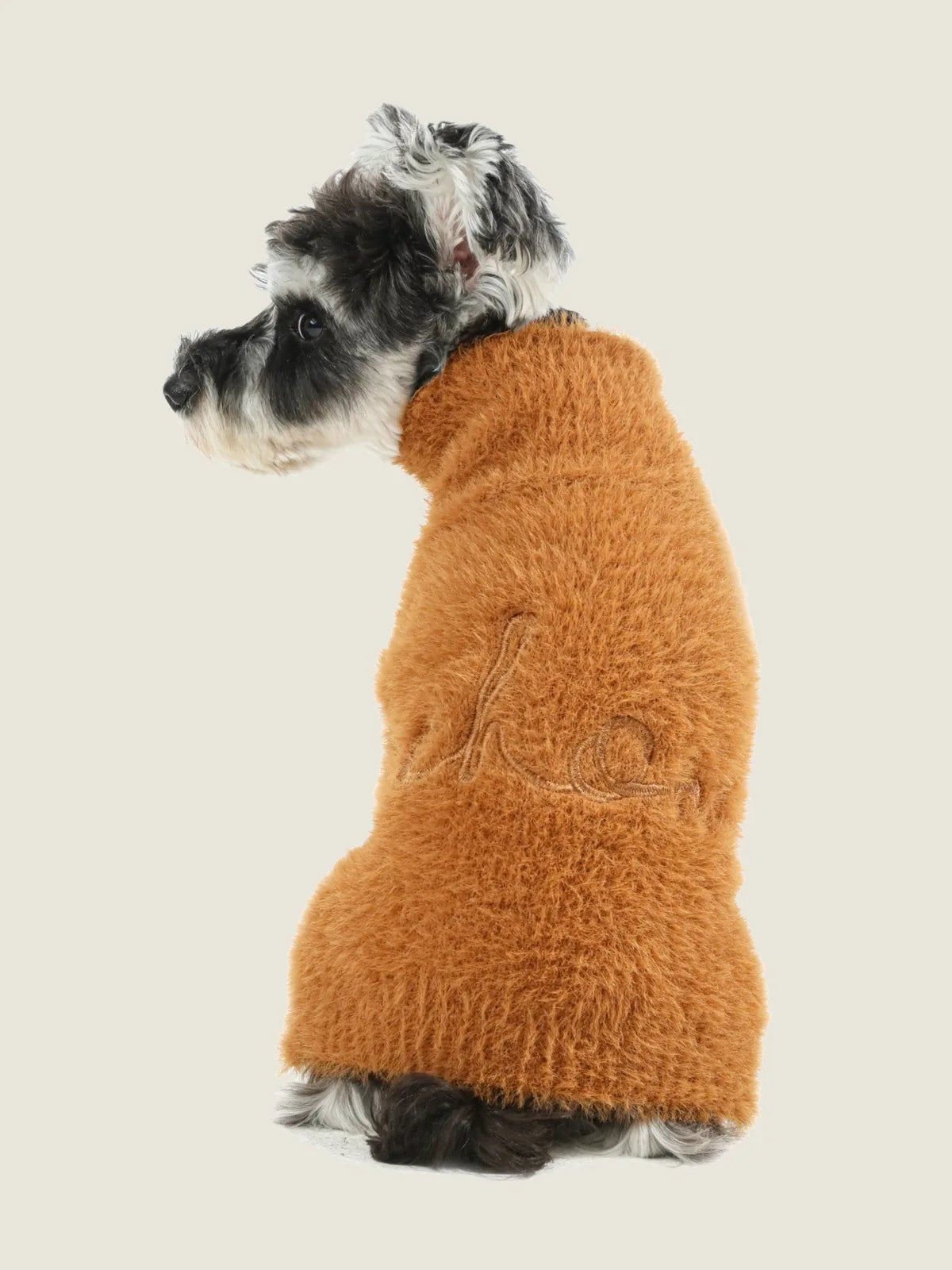 Orange fuzzy dog sweater made of breathable acrylic, showcasing a cozy design suitable for chilly weather.