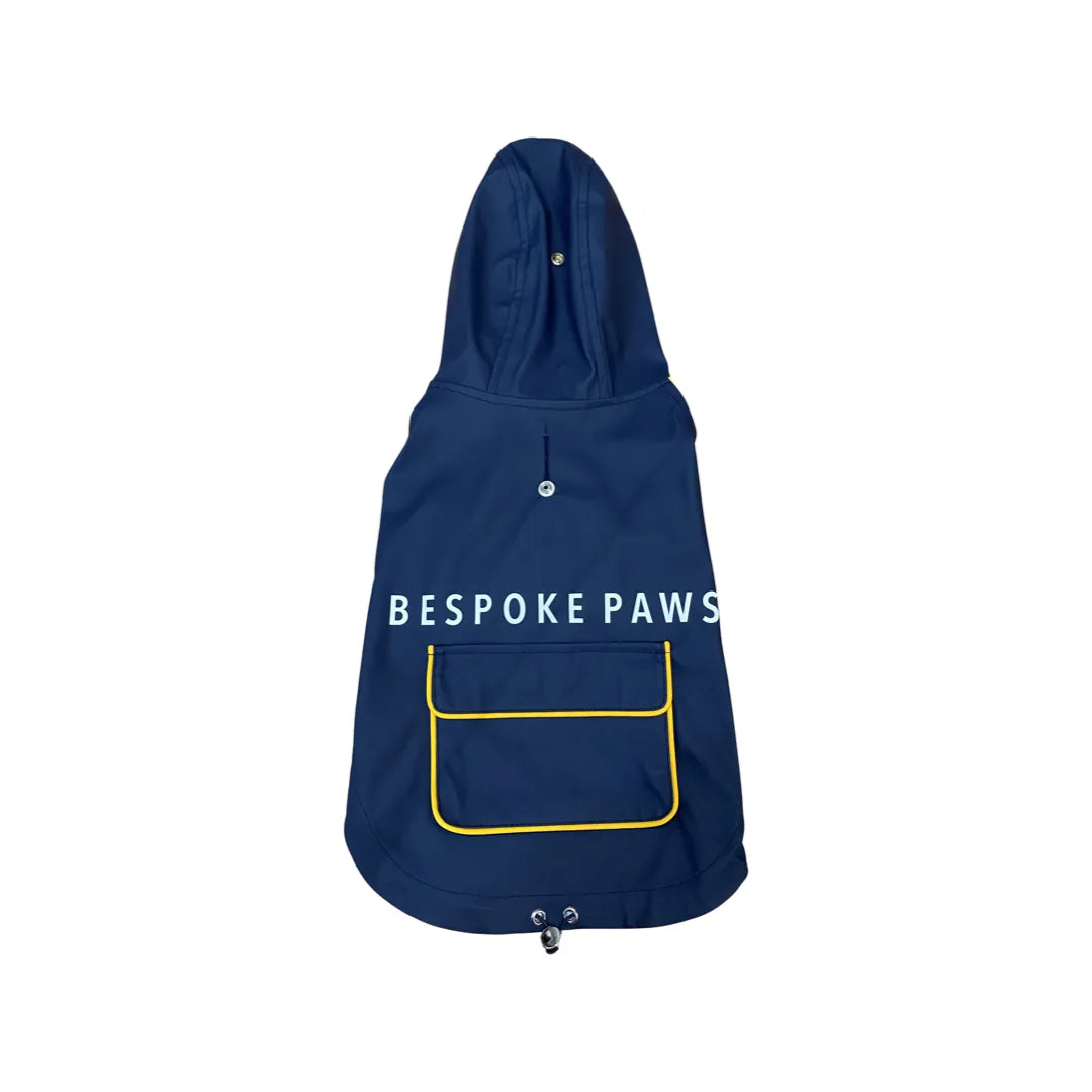 Navy raincoat with a yellow pocket and adjustable hood, designed by BESPOKE PAWS for dogs.