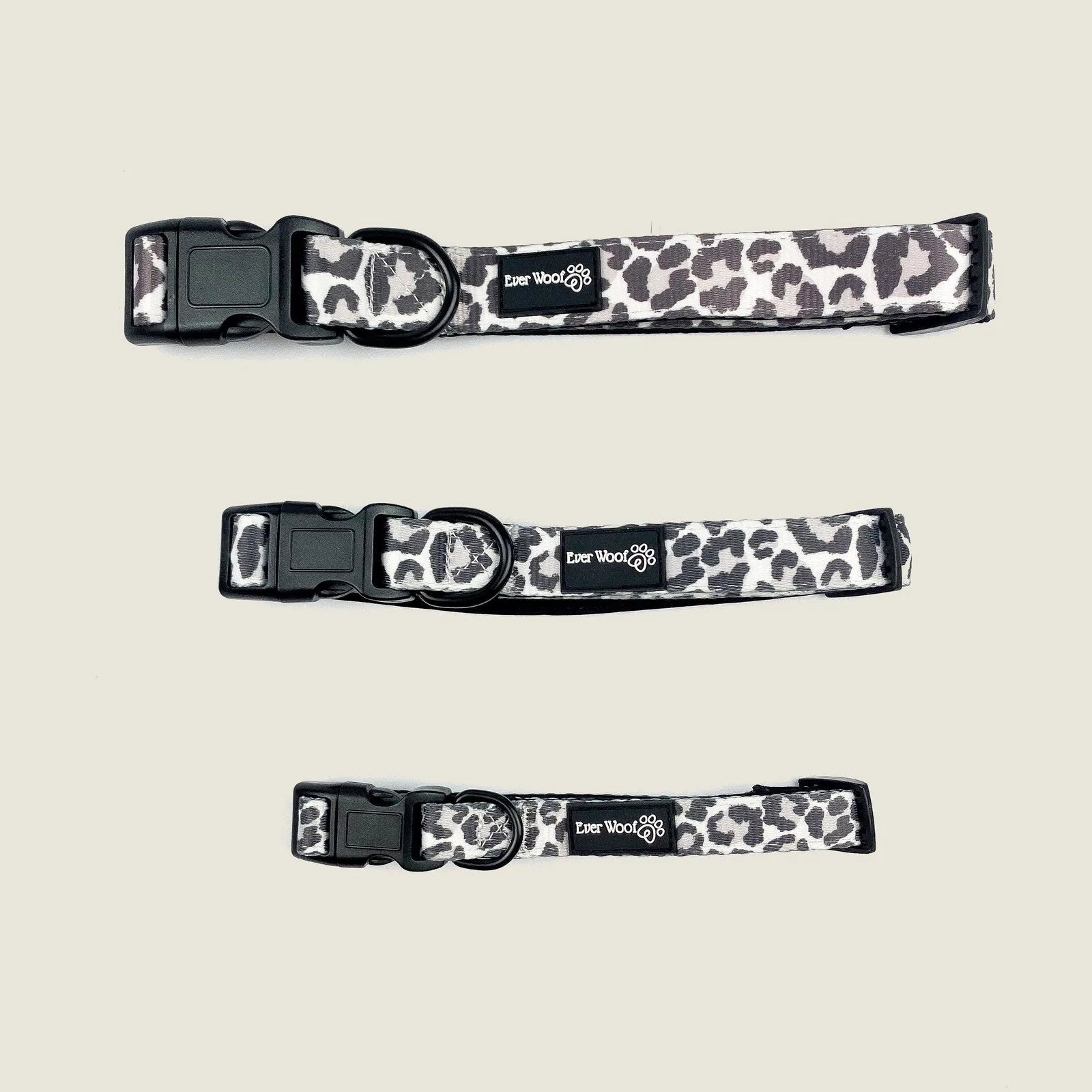 Adjustable dog collars in a leopard print design, featuring black buckles and EverWoof branding.
