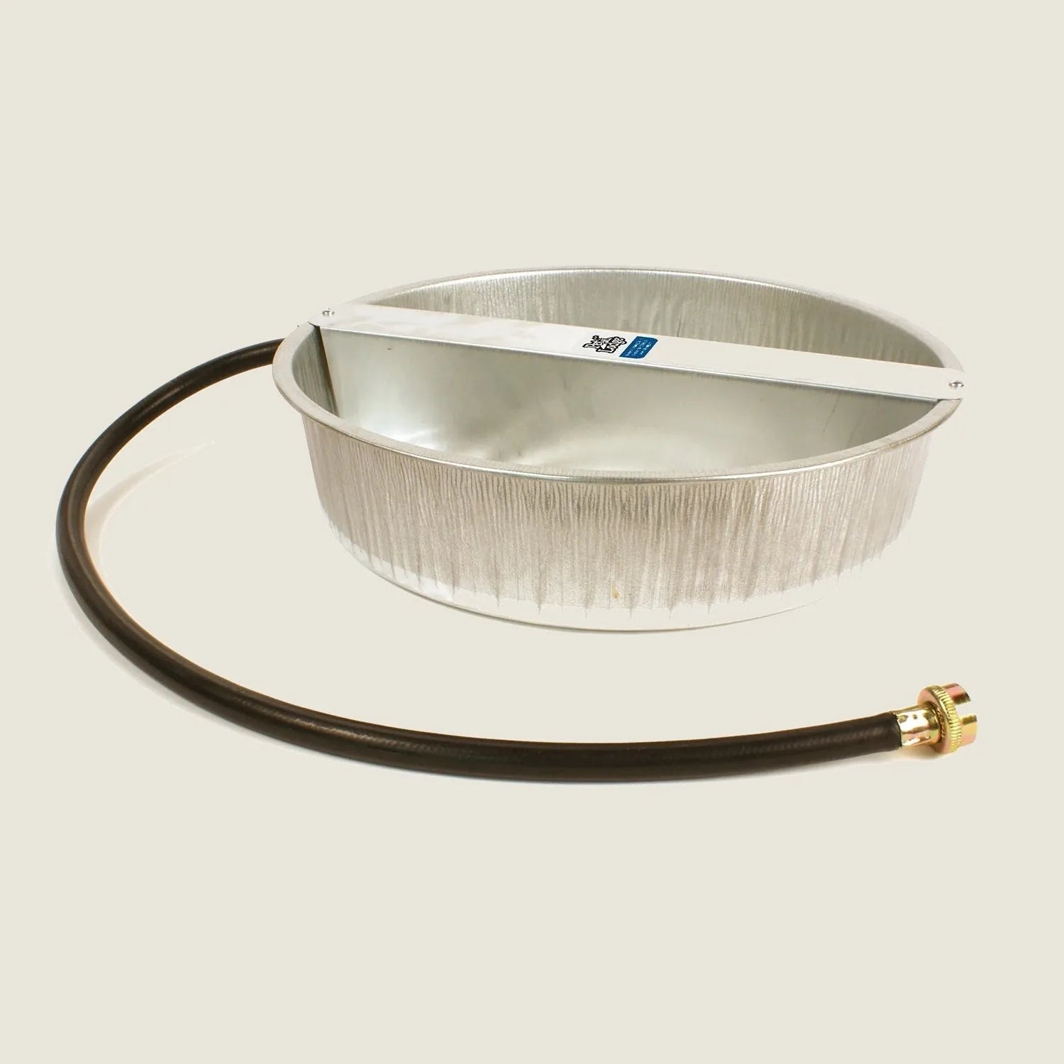 Galvanized metal automatic dog waterer with a black hose, designed for continuous water supply outdoors.