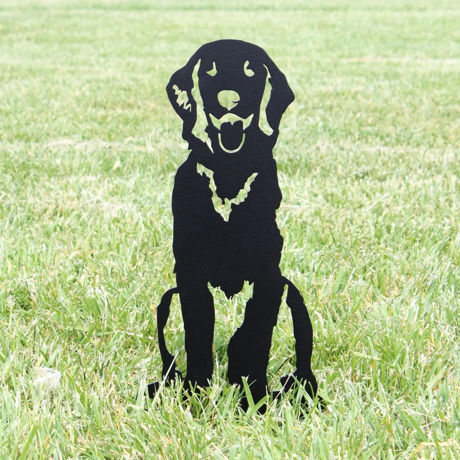 Handcrafted black metal silhouette of a Flat-Coated Retriever sitting on grass, ideal for garden decor or dog lover gifts.
