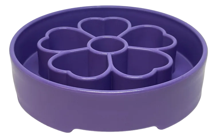 Purple flower-shaped slow feeder dog bowl with segmented chambers for slowing down mealtime and encouraging foraging.