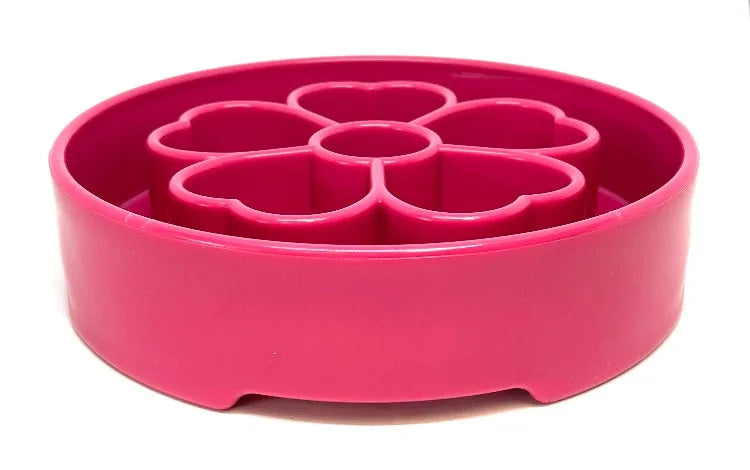 Pink flower-shaped slow feeder dog bowl with segmented chambers for engaging mealtime, made of non-toxic TPE.