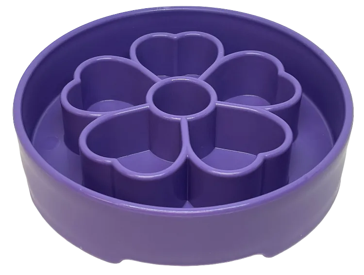 Flower-shaped purple slow feeder dog bowl designed for enrichment, featuring segmented chambers for healthier eating.