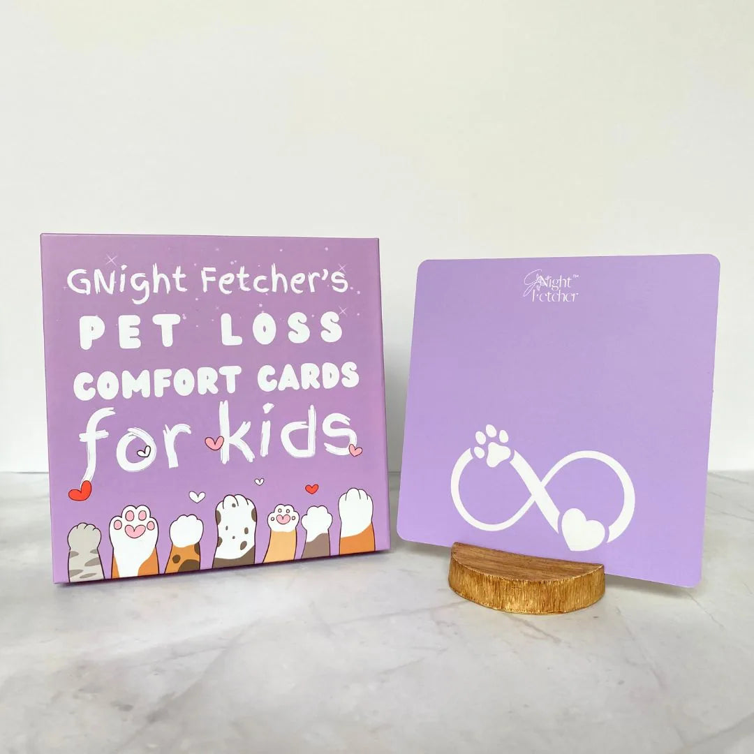 Purple box of "Pet Loss Comfort Cards for Kids" by GNight Fetcher, featuring playful animal paws and an infinity symbol.