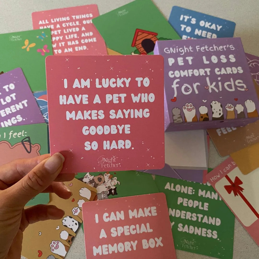 Bright pink card featuring the text, "I AM LUCKY TO HAVE A PET WHO MAKES SAYING GOODBYE SO HARD," amidst affirmation cards.