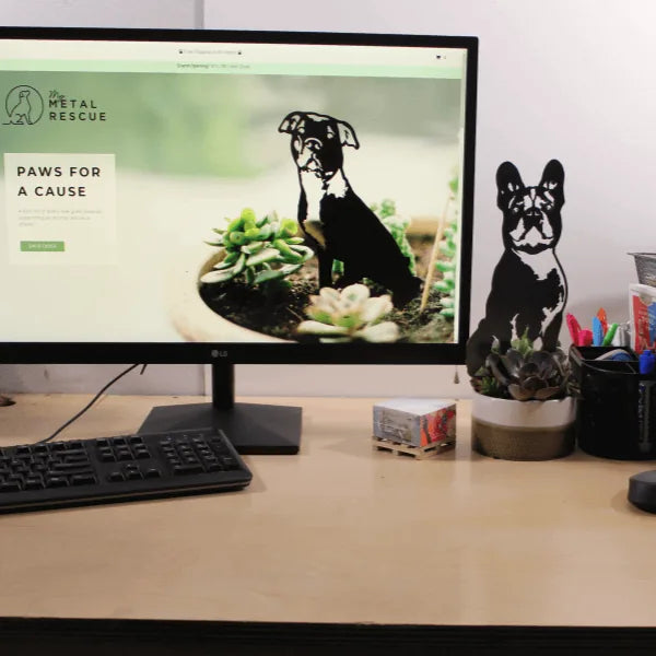 Handmade French Bulldog metal art silhouette in black displayed beside a succulent planter on a desk.